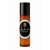 Amberkleurige roll-on parfum fles met zwarte dop van Parfumolie NR. 8 Black XS, authentieke Arabische parfum voor een energieke start